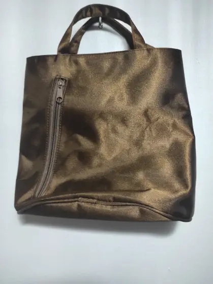 Bolso de mano Revlon