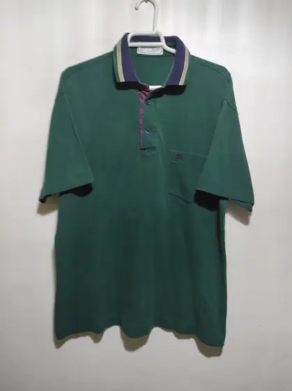 Polo manga corta Burberrys talla 4 equivale a una M
