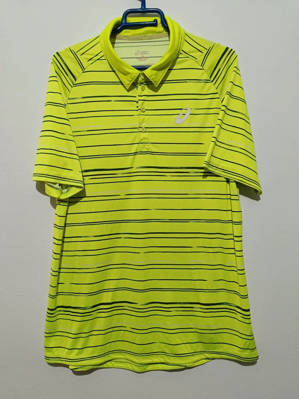 Polo Asics Graphic amarillo bela Motiondry talla L ver medidas