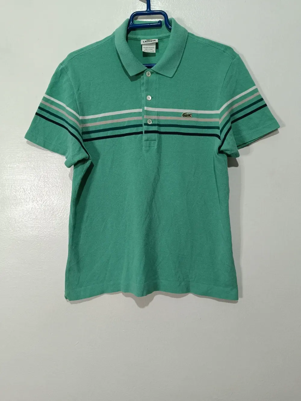 Polo Verde a rayas Lacoste talla 4 equivale a una M sirve para S ver medidas